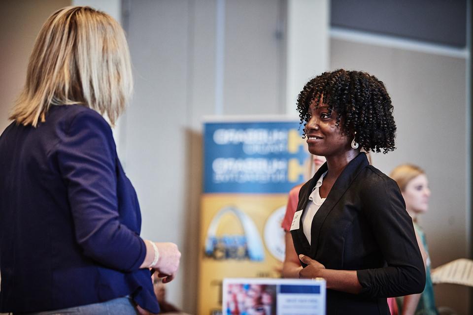 Student talks with employers at 博彩网址大全 career fair at the Busch Student enter